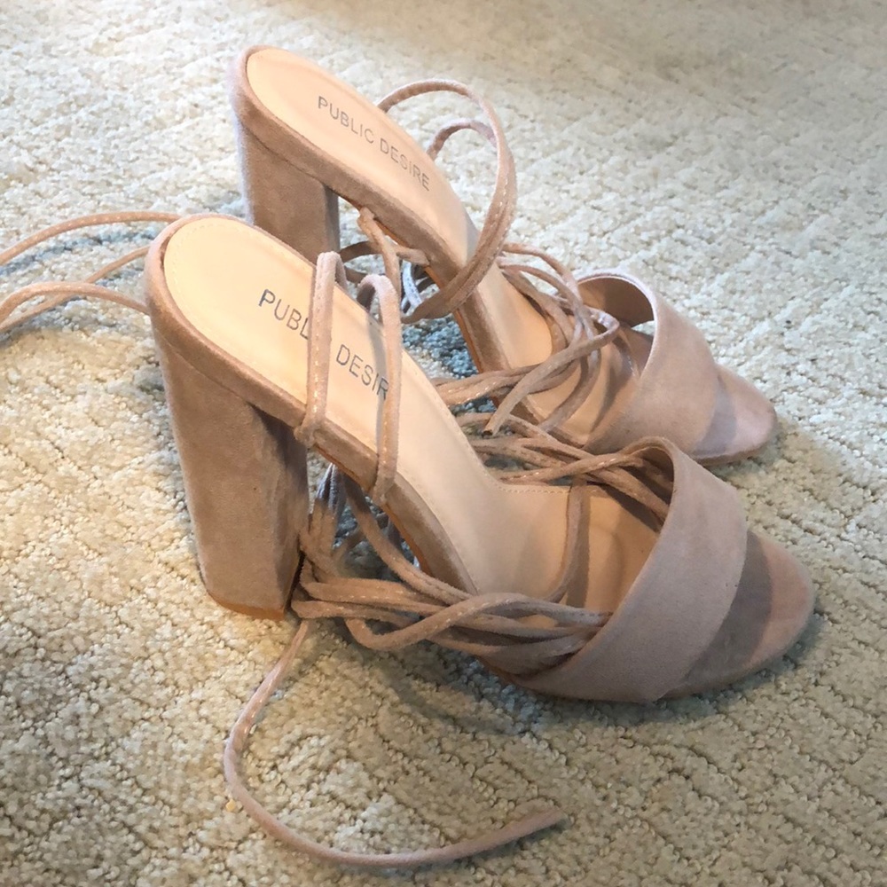 Nude strap up heels.